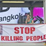 Tourist Watches Anti-Government Protests